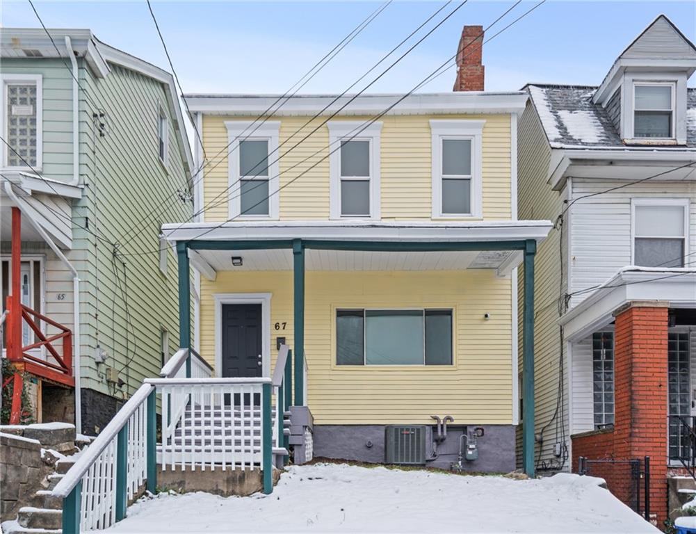 67 Ruth Street Pittsburgh, PA 15211 - Photo 25 of 26 a front view of a house with large windows