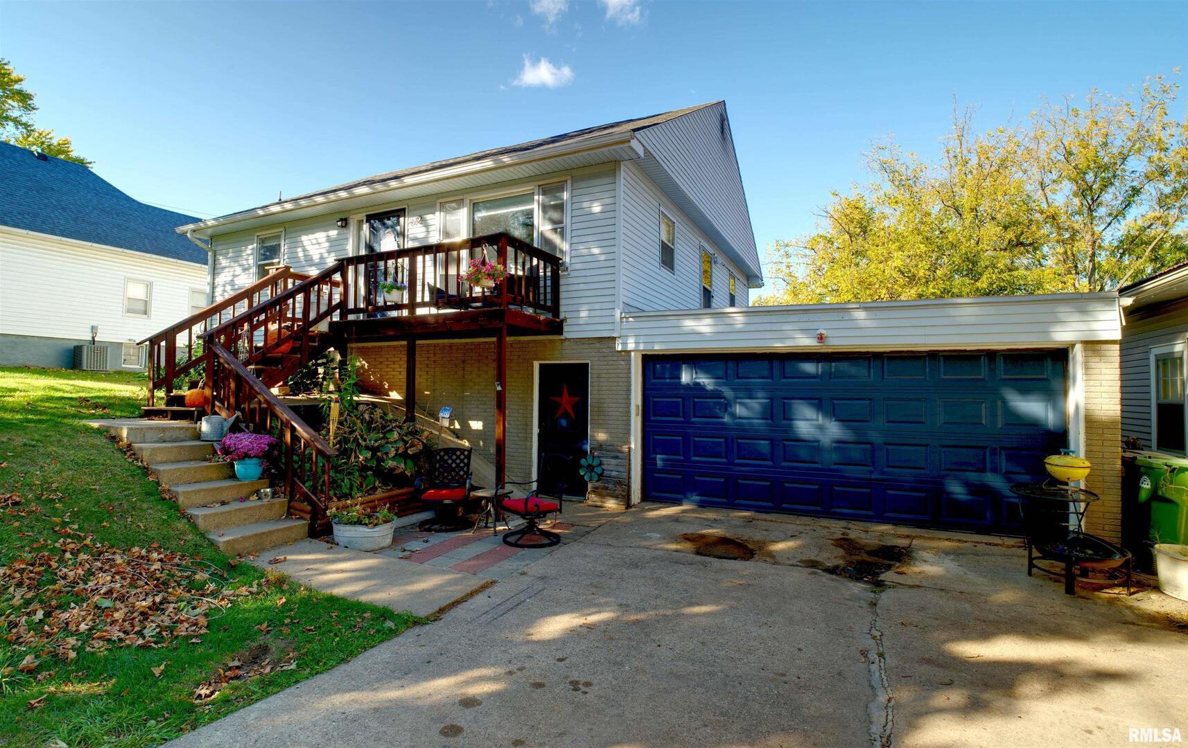 a view of a house with yard porch and furniture