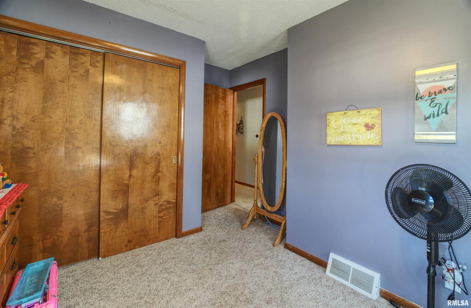 872 5th Avenue North Clinton, IA 52732 - Photo 12 of 19 a view of bathroom with a tub and mirrors