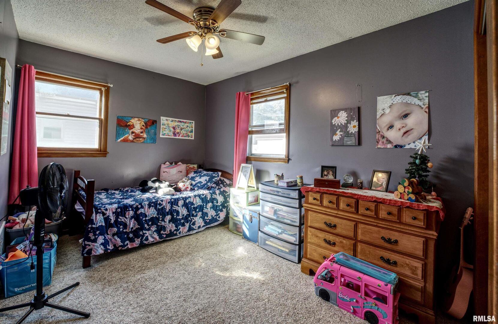 872 5th Avenue North Clinton, IA 52732 - Photo 13 of 19 a bedroom with bed and a window