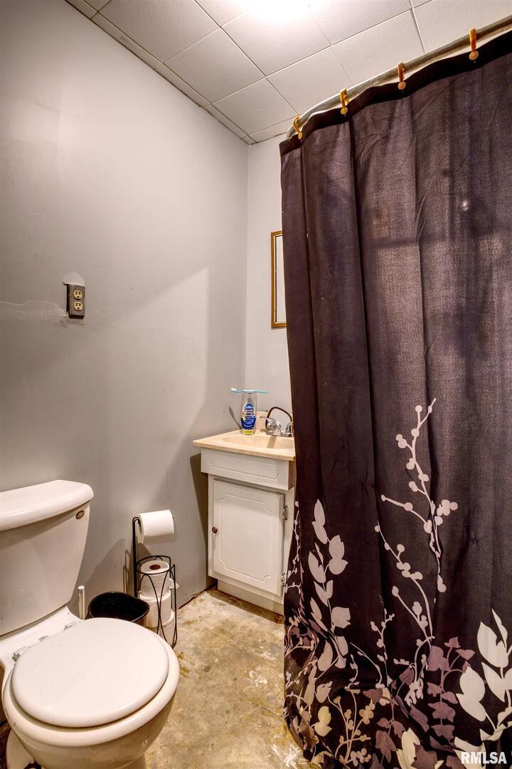 872 5th Avenue North Clinton, IA 52732 - Photo 19 of 19 a white toilet sitting next to a bathroom sink