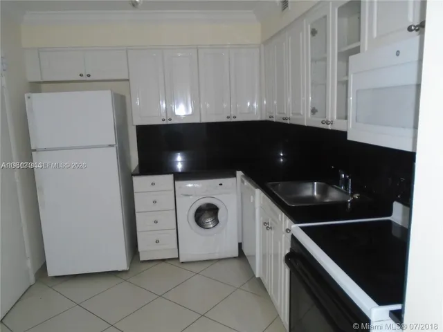 an aerial view of a residential houses with outdoor space lake view