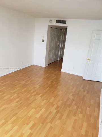 a view of a lake with a yard