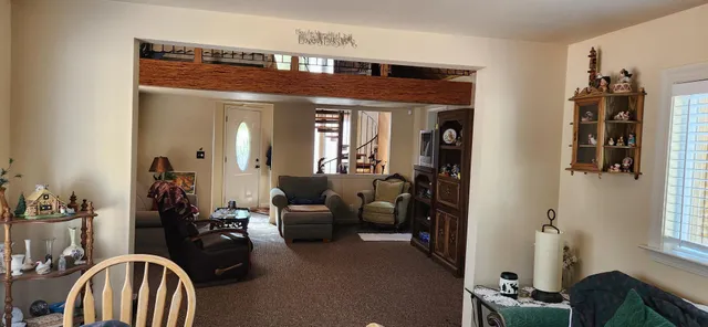 a view of a livingroom with furniture and windows