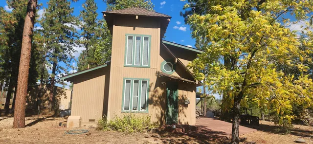 a view of a patio with table and chairs