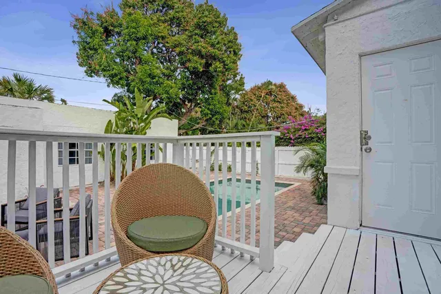 a view of balcony with wooden floor