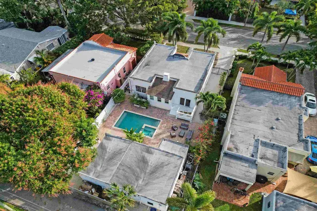 an aerial view of a house with outdoor space
