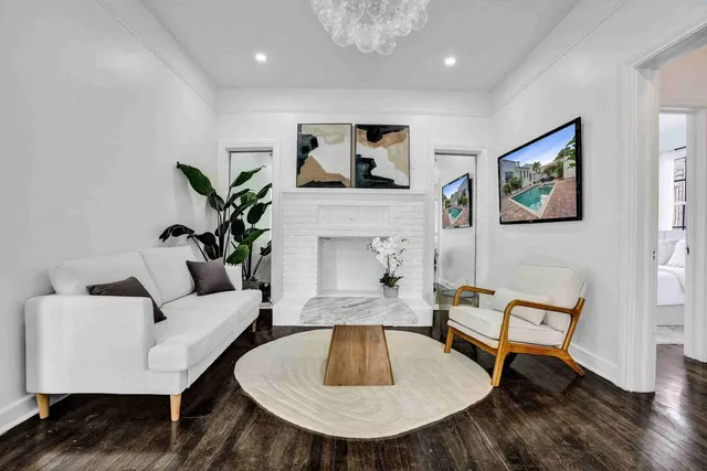 a living room with furniture and a fireplace