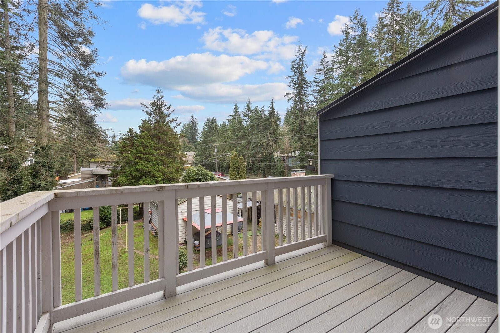 23413 Edmonds Way, Unit A2 Edmonds, WA 98026 - Photo 28 of 40 a balcony with wooden floor and outdoor space