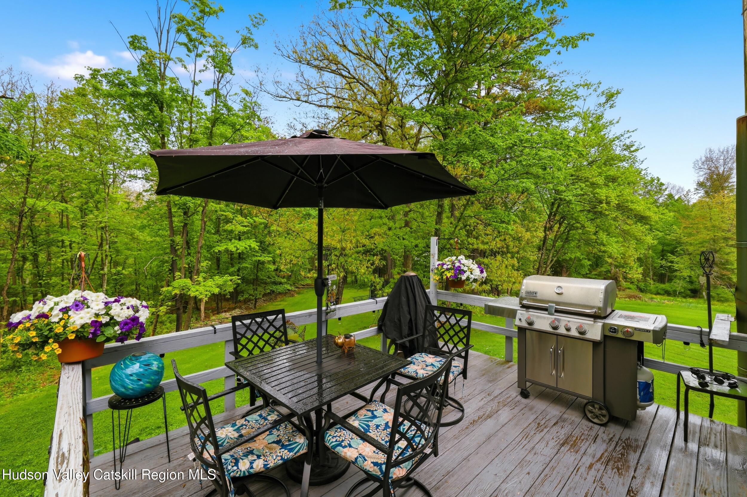 186 Cedar Hill Road High Falls, NY 12440 - Photo 15 of 33 a view of a tables and chairs under an umbrella