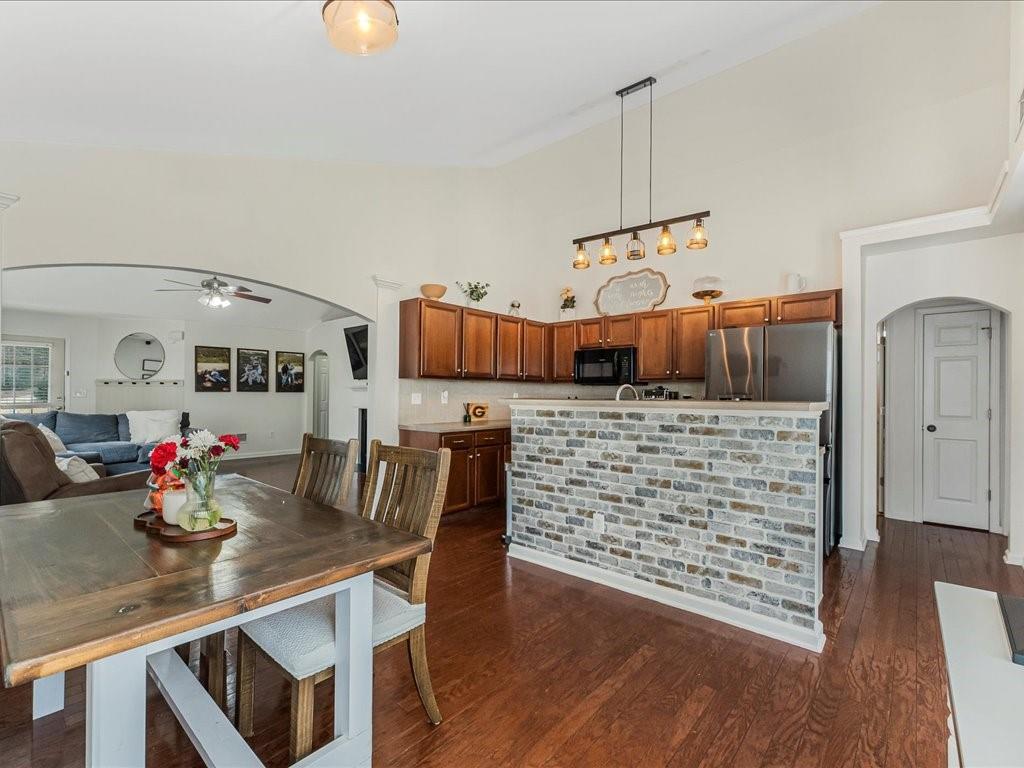 301 Summerstone Court Canton, GA 30114 - Photo 11 of 31 a view of a dining room with furniture and wooden floor