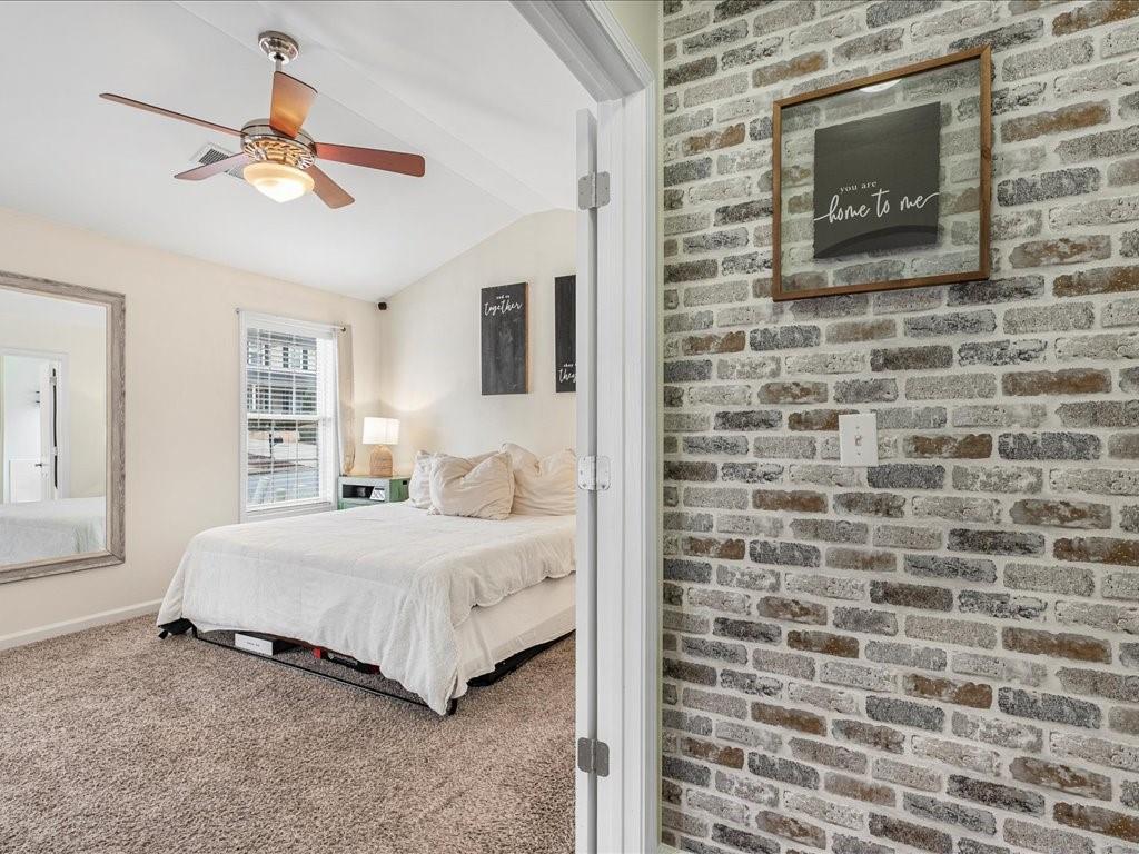 301 Summerstone Court Canton, GA 30114 - Photo 16 of 31 a bedroom with a bed and a flat screen tv