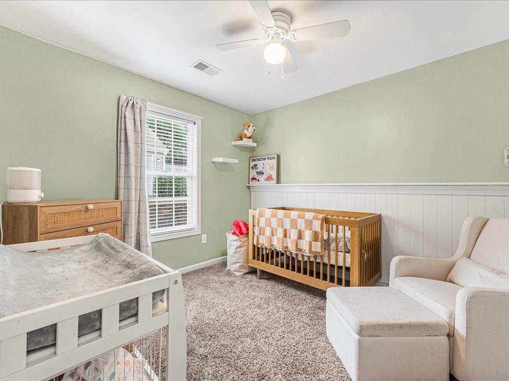 301 Summerstone Court Canton, GA 30114 - Photo 24 of 31 a bedroom with furniture and windows