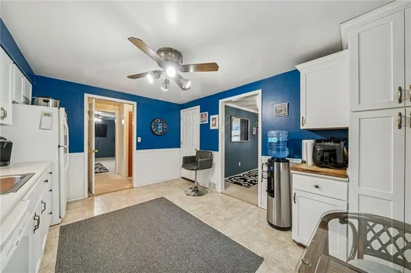 a view of a livingroom with furniture and a kitchen