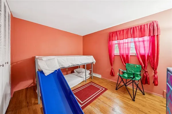 a view of a bedroom with natural light
