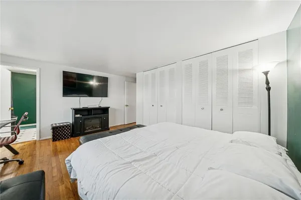 a bathroom with a toilet a sink and shower