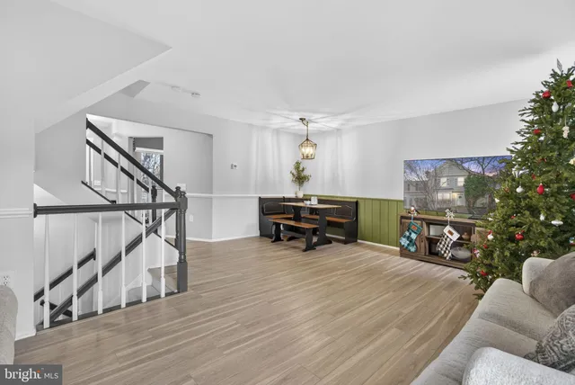a bathroom with a granite countertop toilet sink and mirror