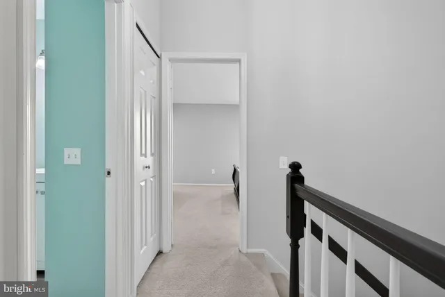 a bedroom with furniture and a wooden floor