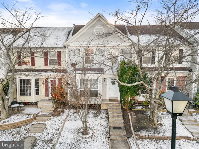 a kitchen with a refrigerator stove and sink