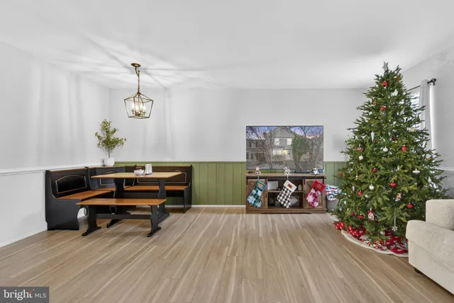 a bathroom with a toilet sink vanity and mirror