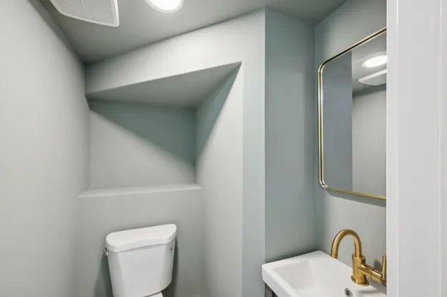 an empty room with windows and entrance