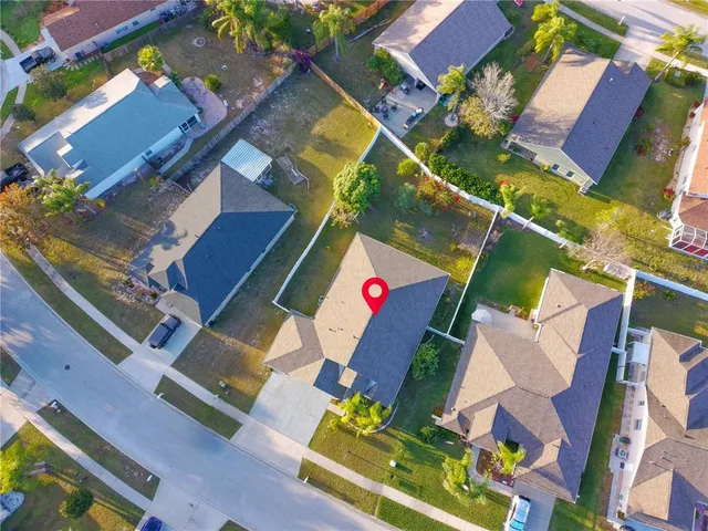 an aerial view of residential house with outdoor space and swimming pool