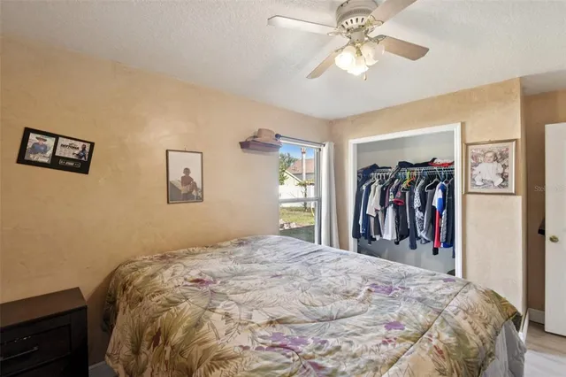 a bed room with a bed and a walk in closet