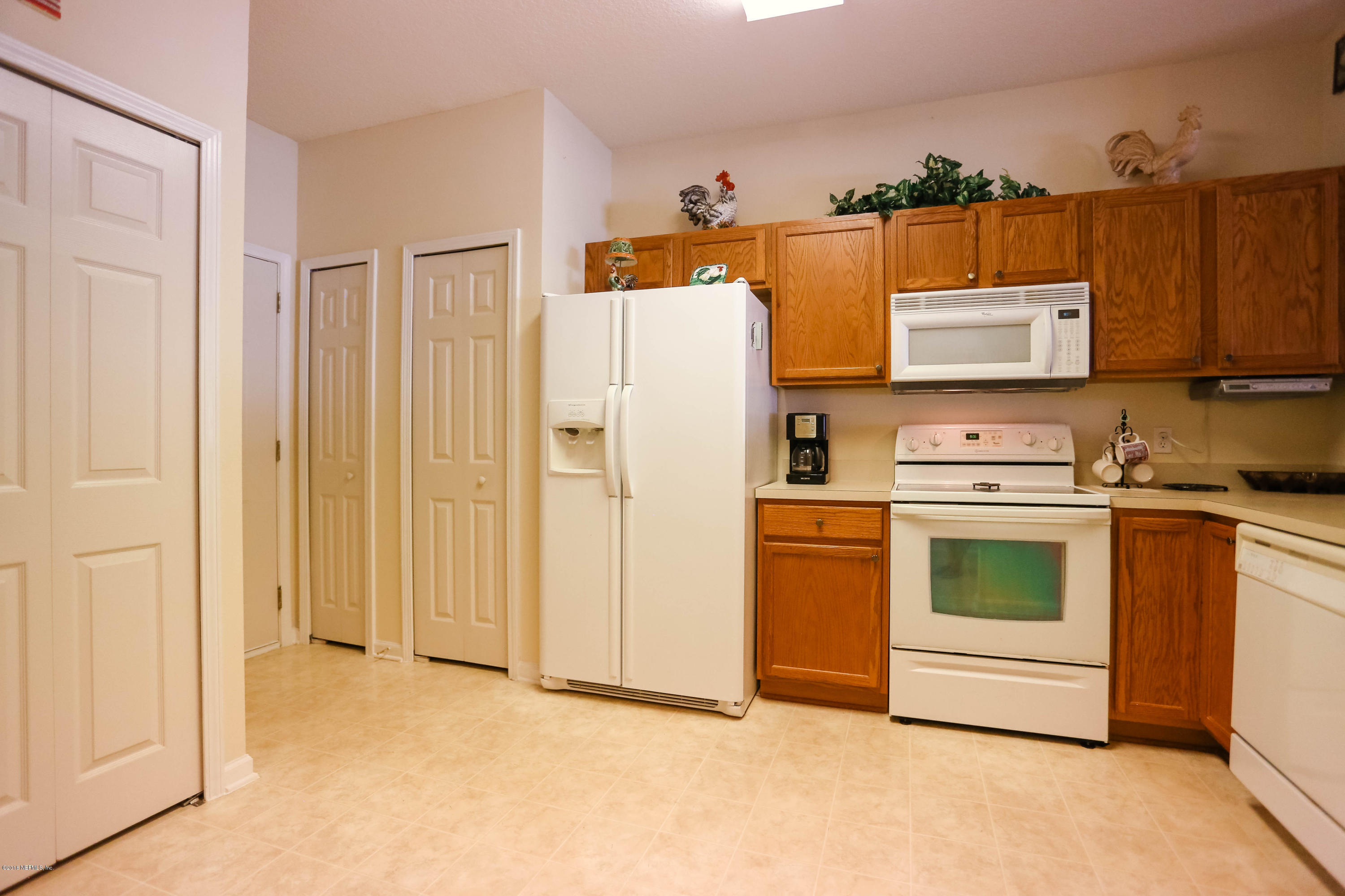 1205 Southern Stream Court Jacksonville, FL 32259 - Photo 12 of 42 a kitchen with stainless steel appliances granite countertop a refrigerator a stove and a sink
