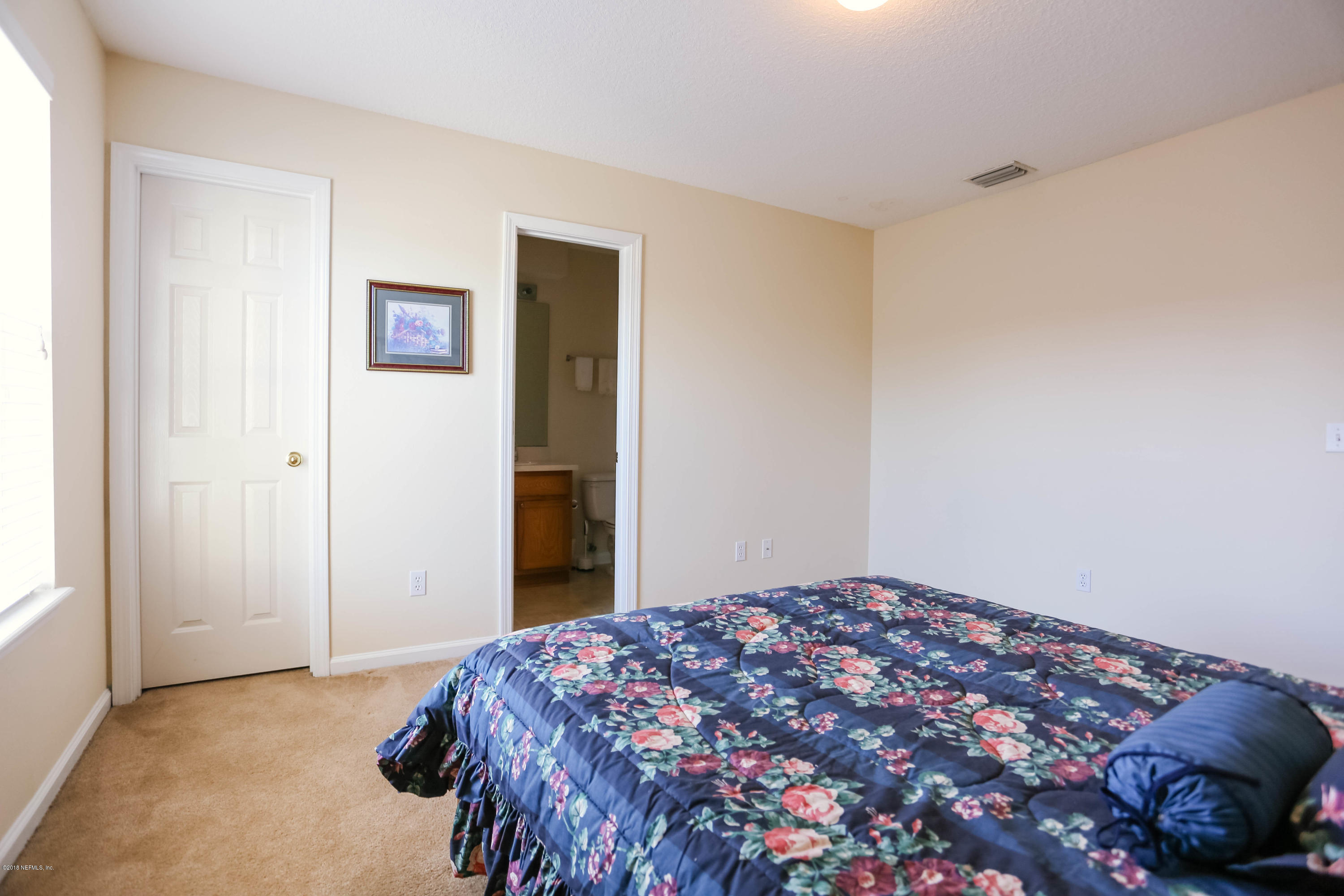 1205 Southern Stream Court Jacksonville, FL 32259 - Photo 18 of 42 a bedroom with a bed and a window