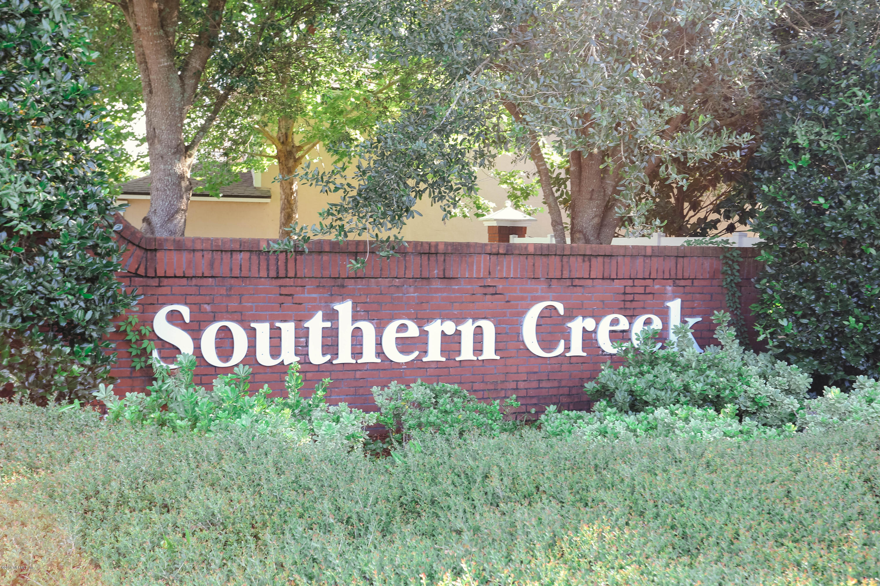 1205 Southern Stream Court Jacksonville, FL 32259 - Photo 29 of 42 a sign that is sitting on a wooden bench
