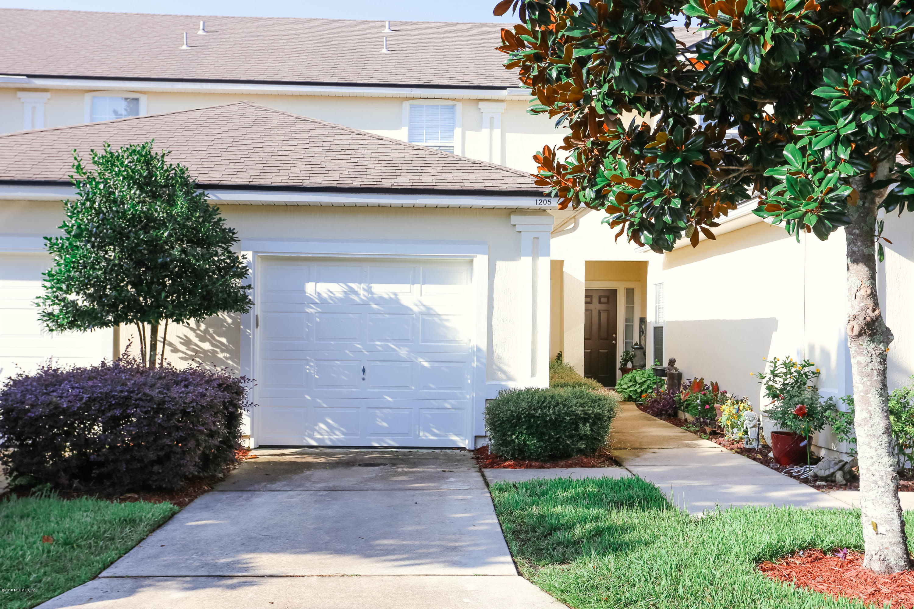 1205 Southern Stream Court Jacksonville, FL 32259 - Photo 3 of 42 a front view of a house with garden