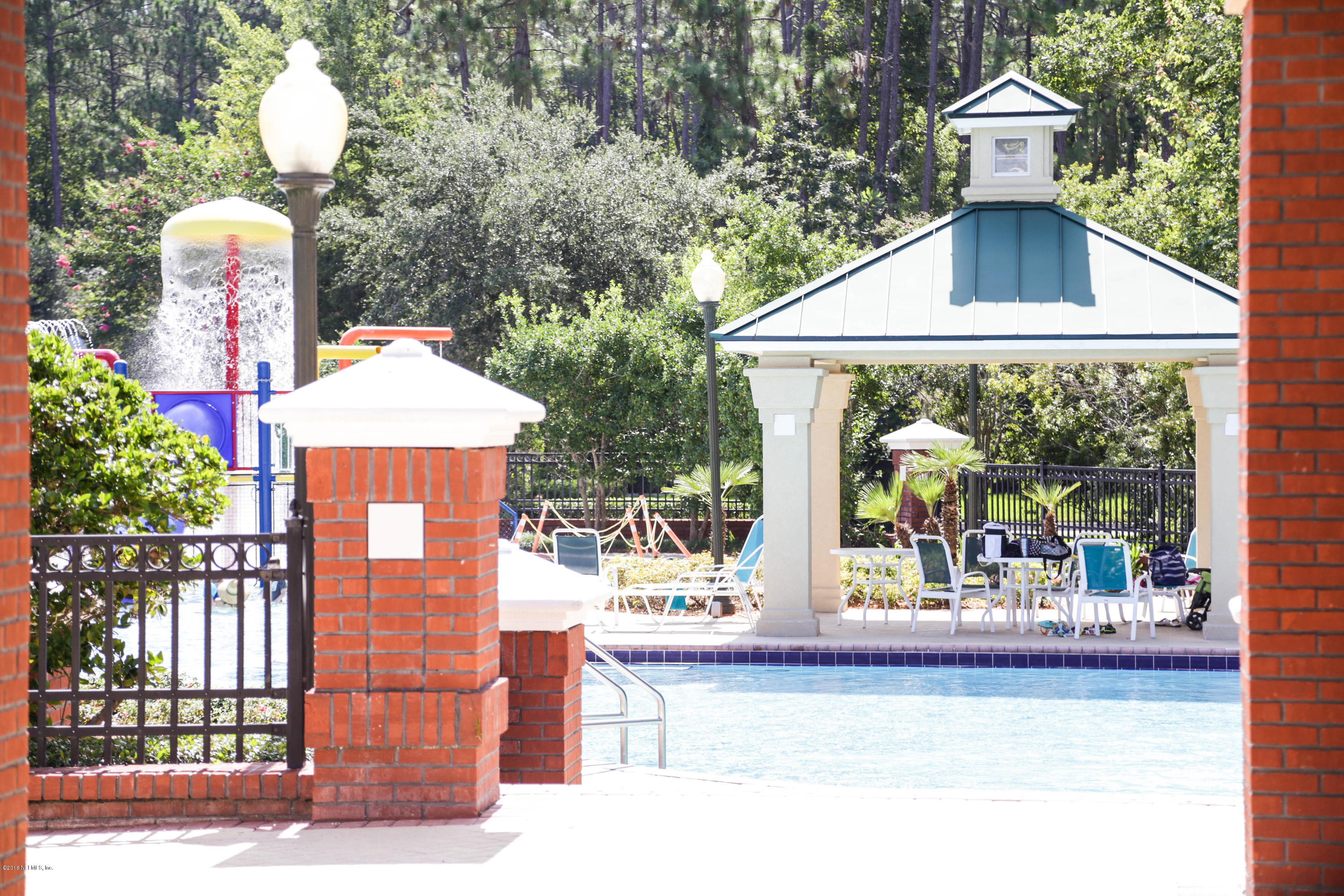 1205 Southern Stream Court Jacksonville, FL 32259 - Photo 35 of 42 a front view of a house with a garden