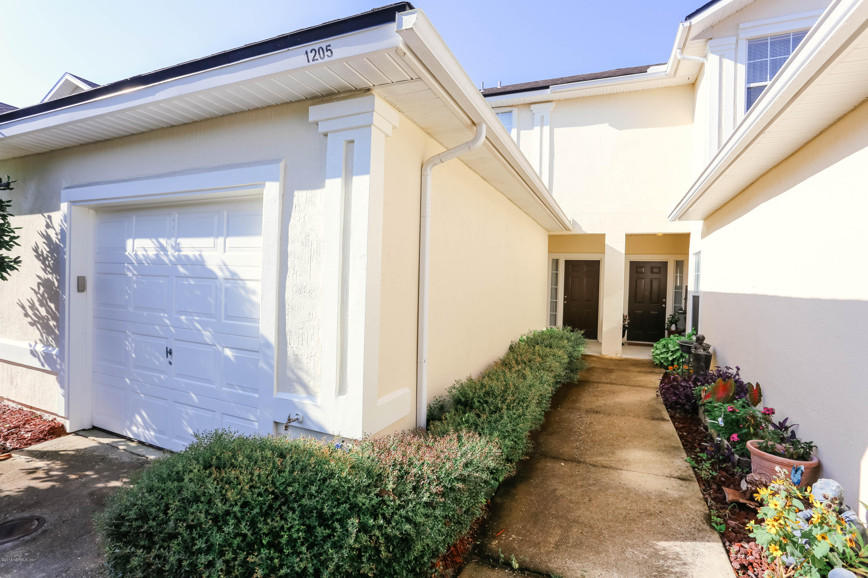 1205 Southern Stream Court Jacksonville, FL 32259 - Photo 4 of 42 a hallway with beautiful flower in it