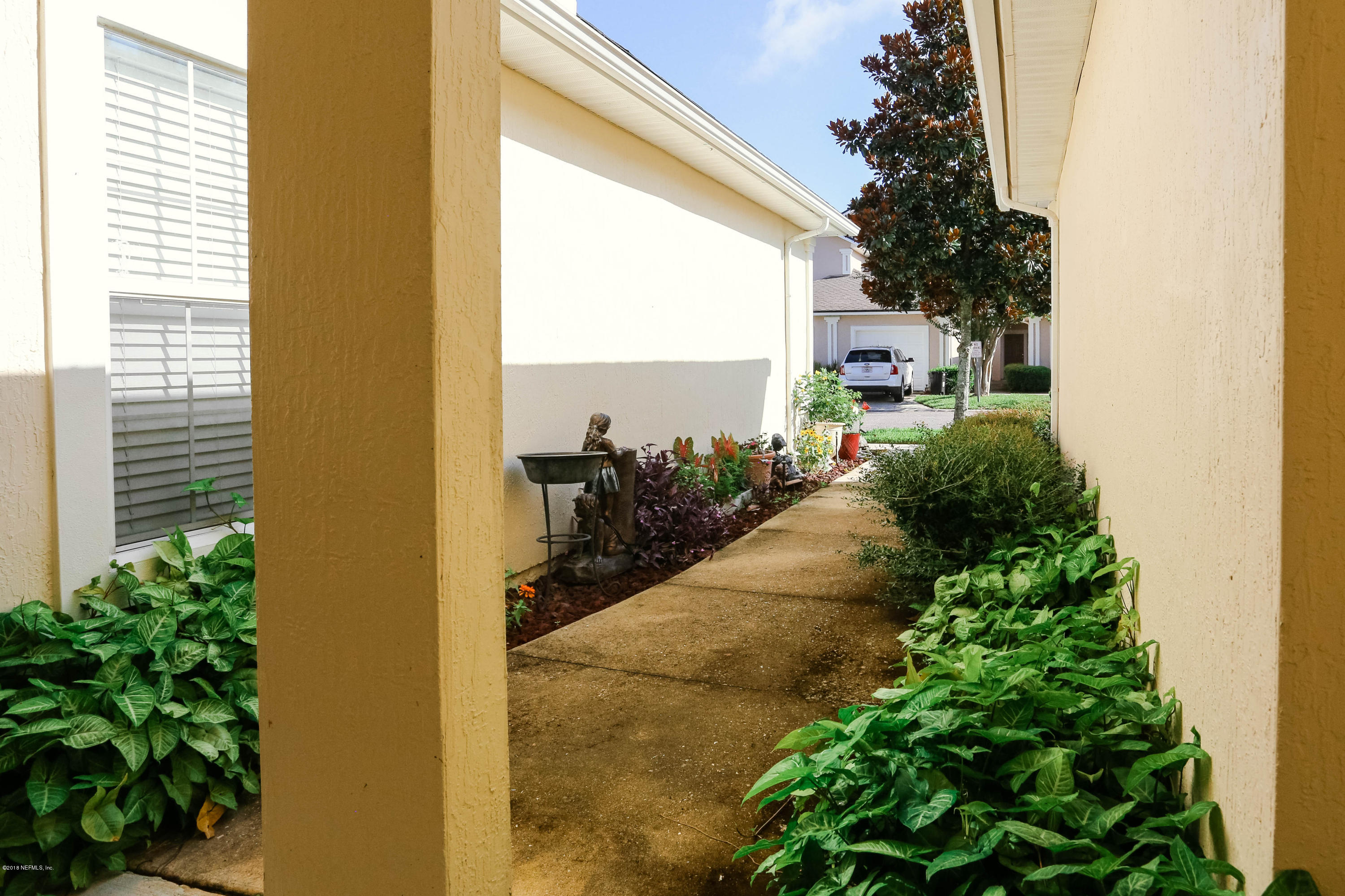 1205 Southern Stream Court Jacksonville, FL 32259 - Photo 6 of 42 a porch with swimming pool and glass door