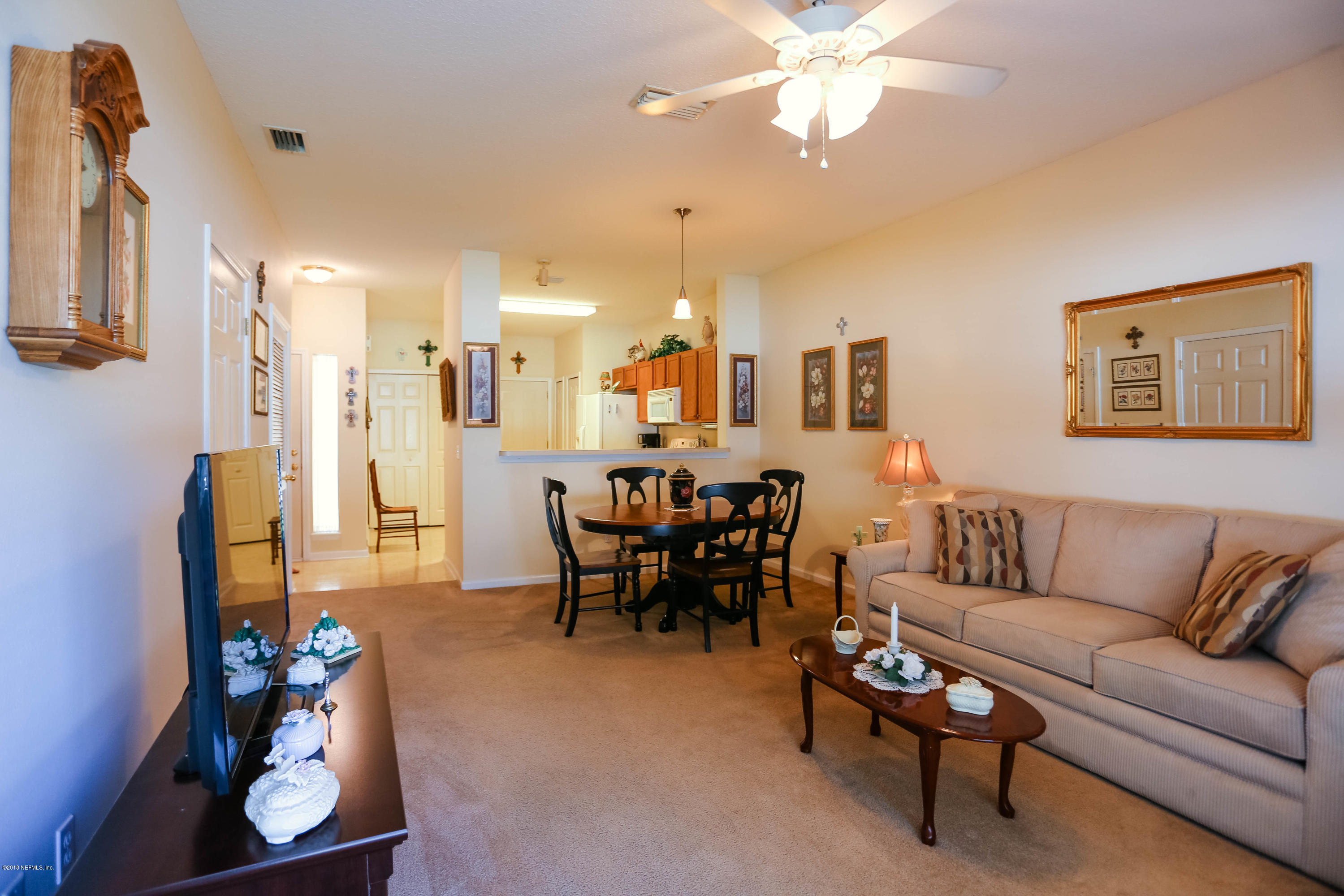 1205 Southern Stream Court Jacksonville, FL 32259 - Photo 8 of 42 a living room with furniture and kitchen view