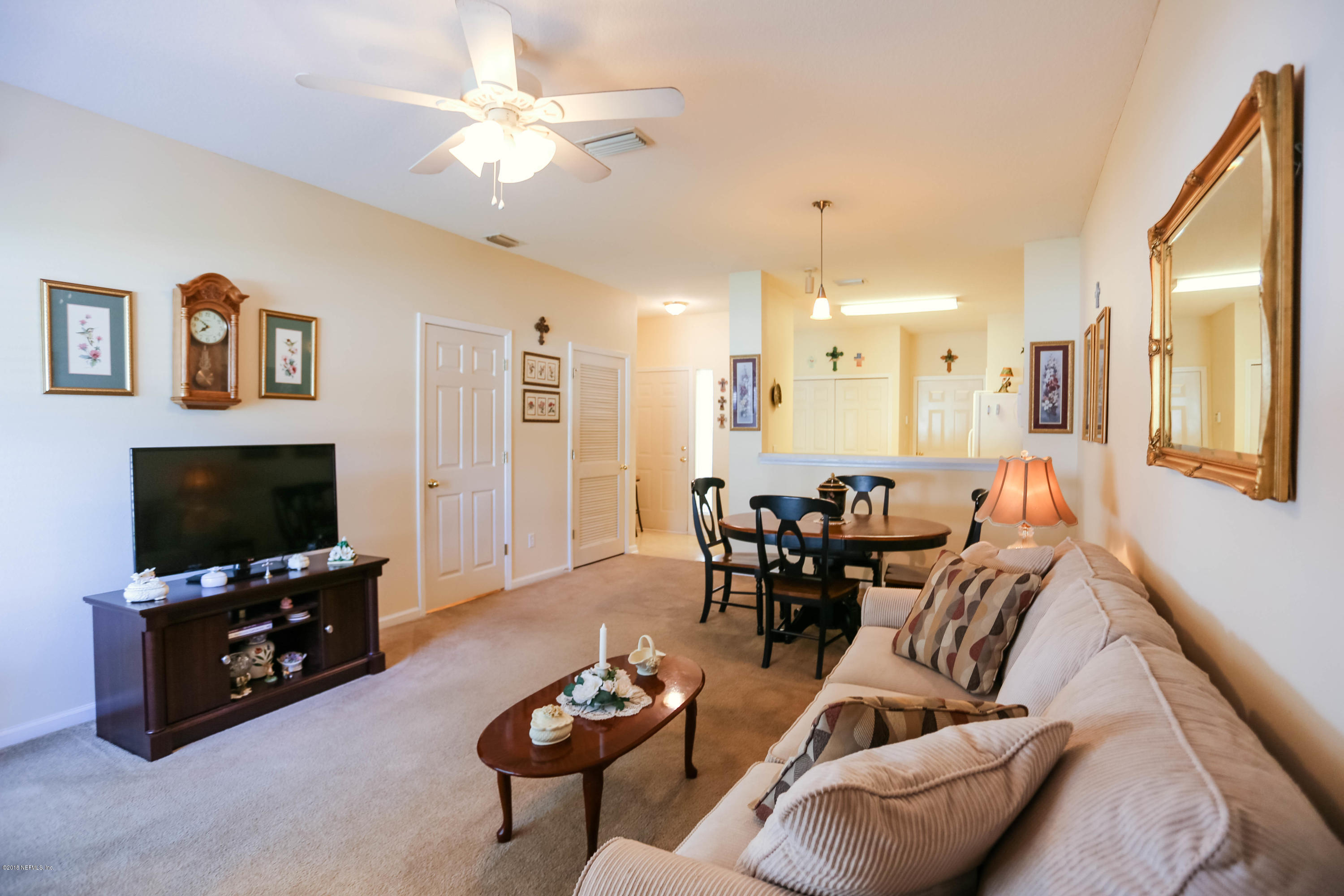 1205 Southern Stream Court Jacksonville, FL 32259 - Photo 9 of 42 a living room with furniture and a flat screen tv