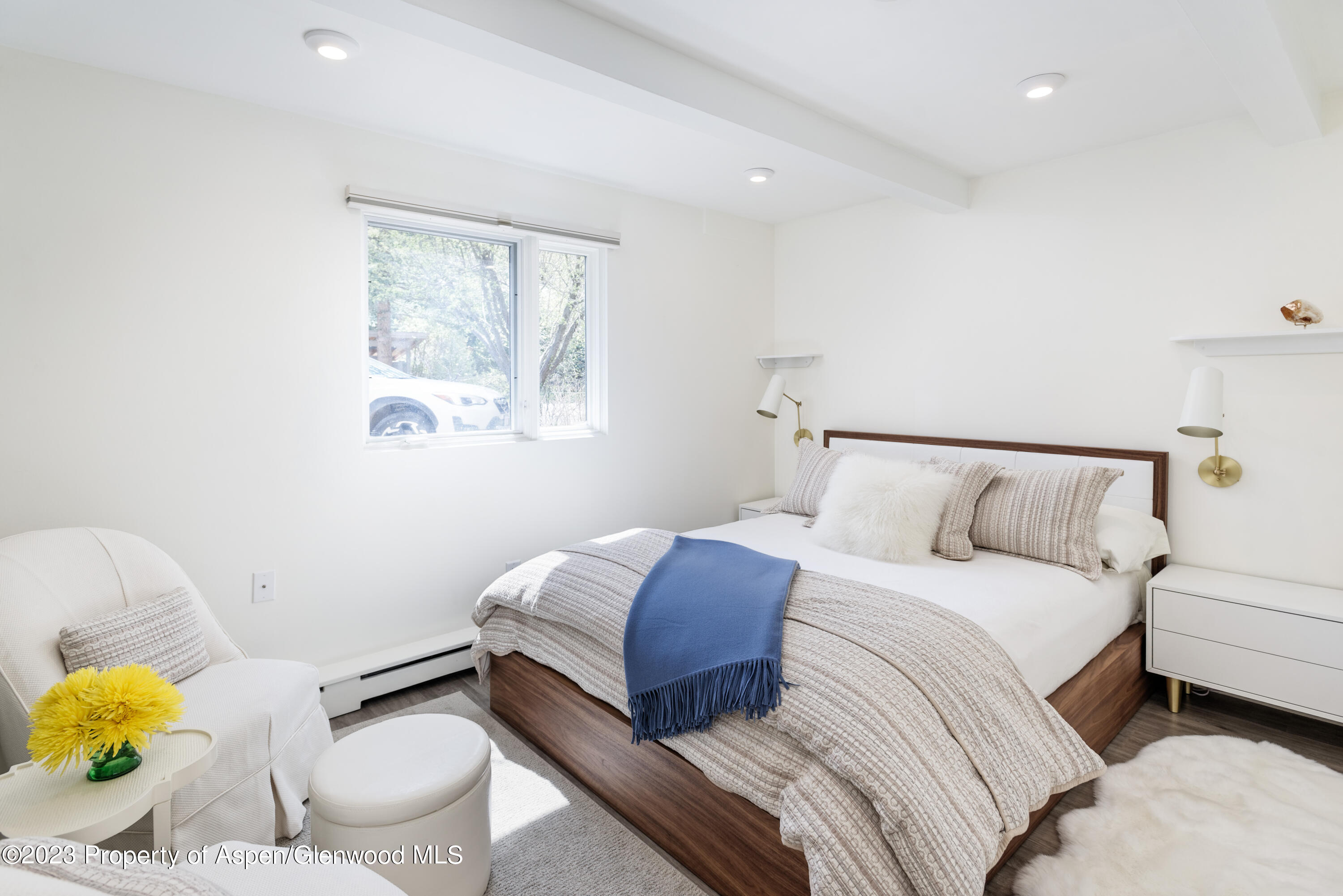 601 South W End Street, Unit 1 Aspen, CO 81611 - Photo 3 of 6 a bedroom with a bed and a window