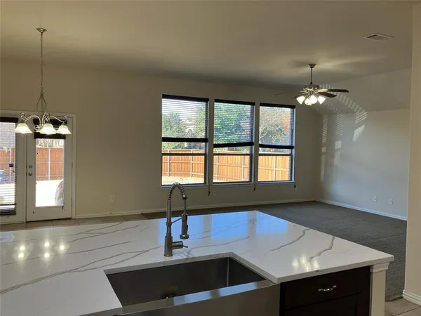 a kitchen with a sink and a window
