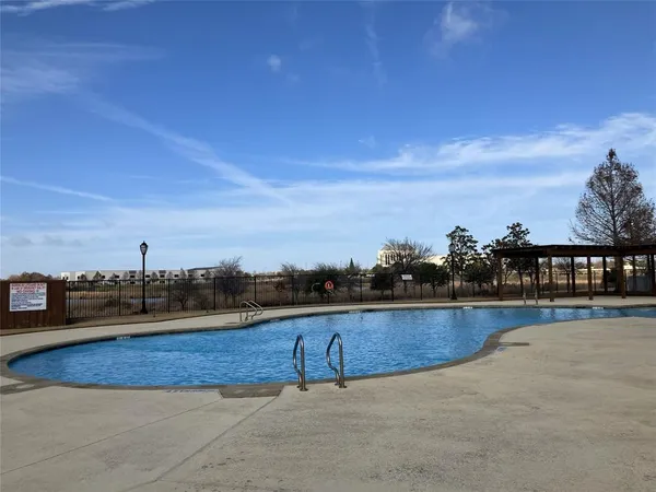 a view of swimming pool with outdoor seating
