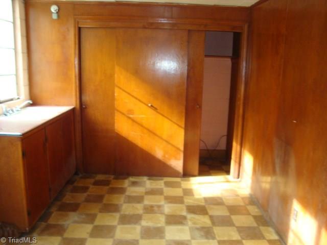 128 Penny Road Jamestown, NC 27282 - Photo 13 of 18 Basement kitchenette and laundry