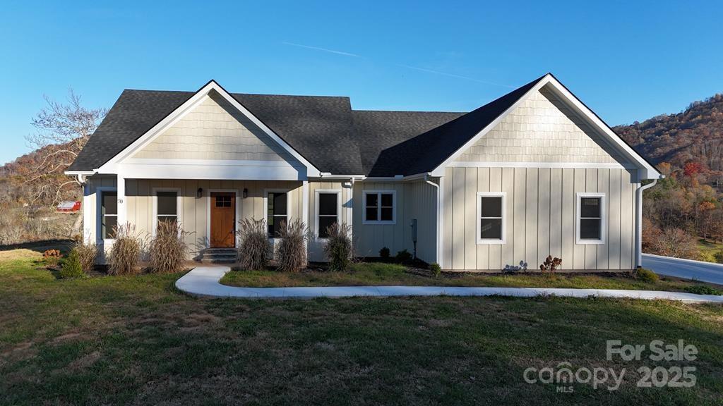 a front view of a house with a yard