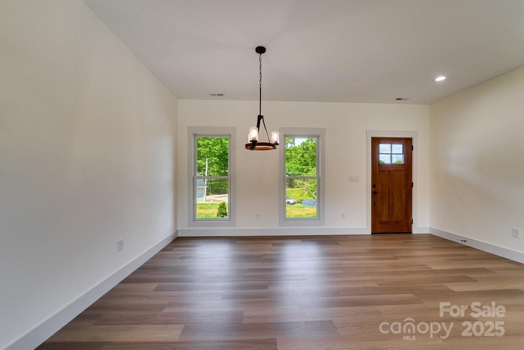70 Knox Best Street Clyde, NC 28721 - Photo 14 of 33 a view of an entryway with wooden floor and windows