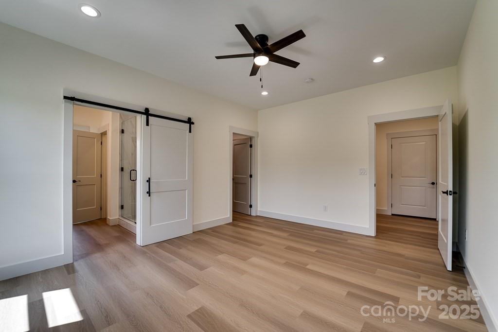 70 Knox Best Street Clyde, NC 28721 - Photo 18 of 33 a view of an empty room and wooden floor
