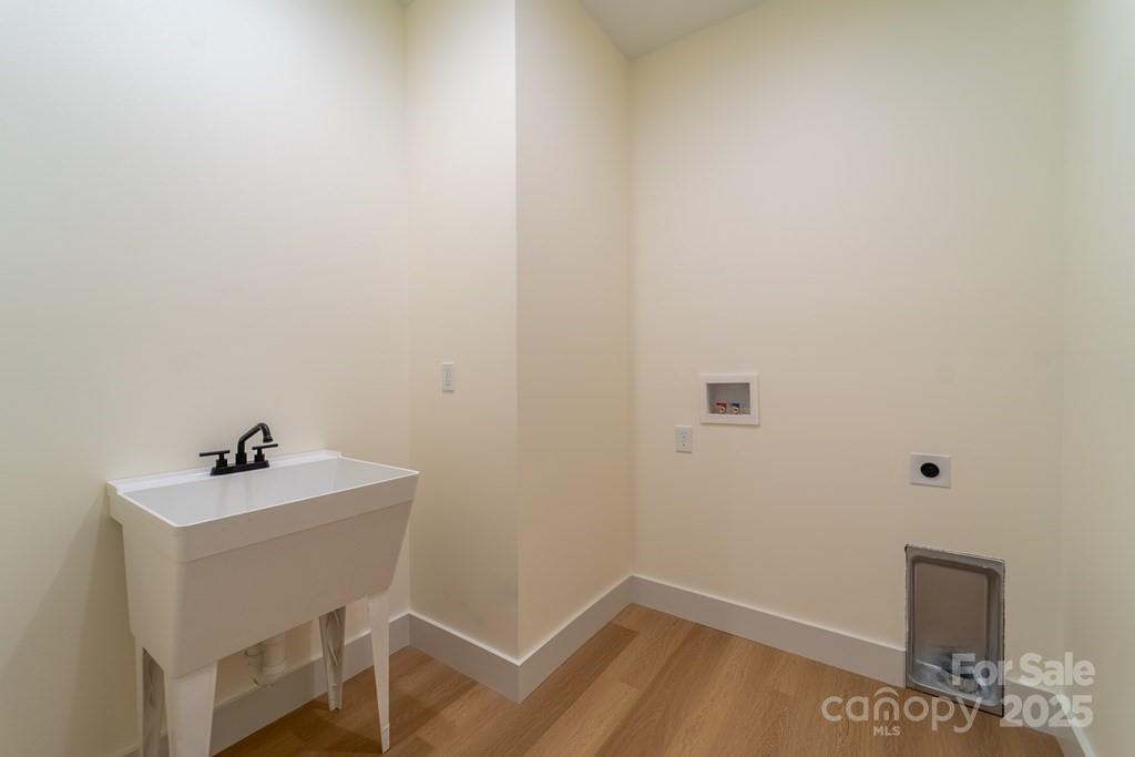 70 Knox Best Street Clyde, NC 28721 - Photo 28 of 33 a bathroom with a sink and a window