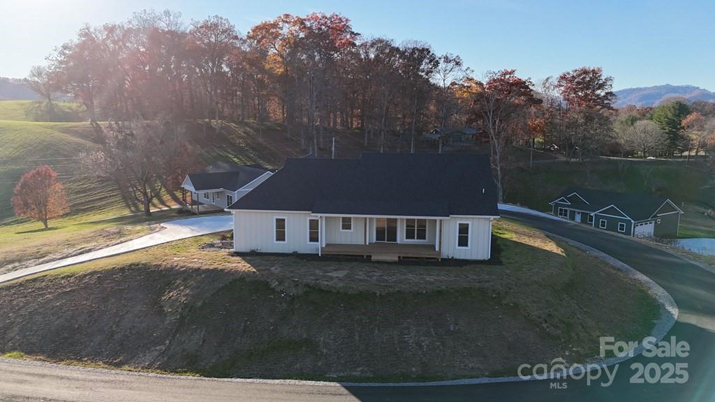 70 Knox Best Street Clyde, NC 28721 - Photo 33 of 33 a view of a house with a yard