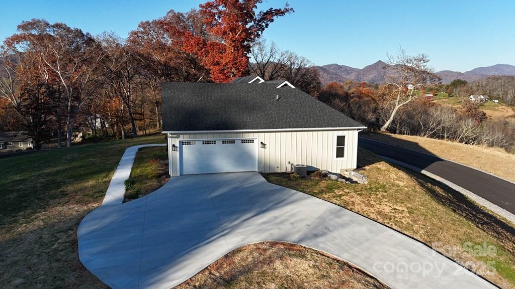 70 Knox Best Street Clyde, NC 28721 - Photo 4 of 33 a view of a house with a yard