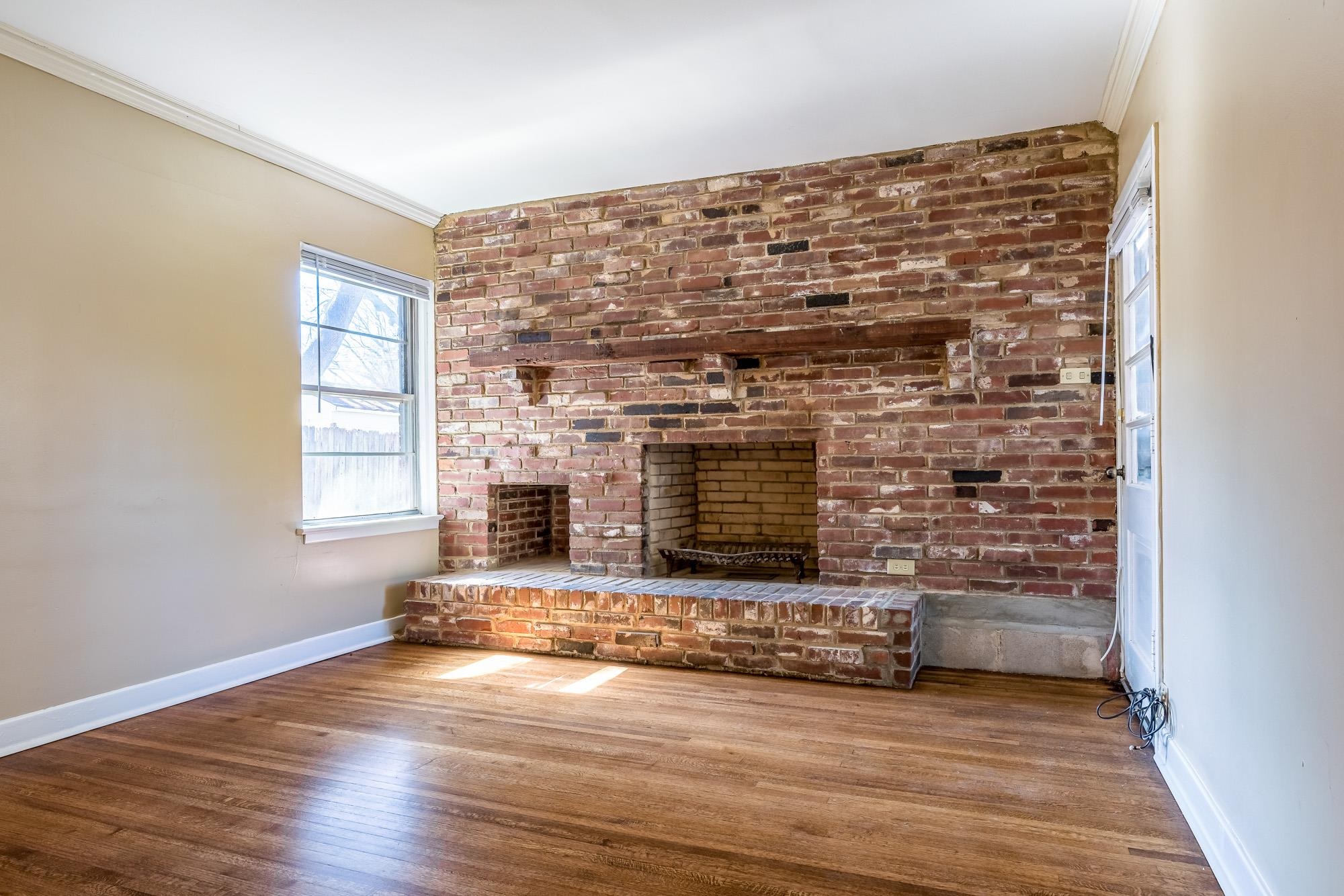 1117 South Perkins Road Memphis, TN 38117 - Photo 14 of 24 a view of fireplace and wooden floor