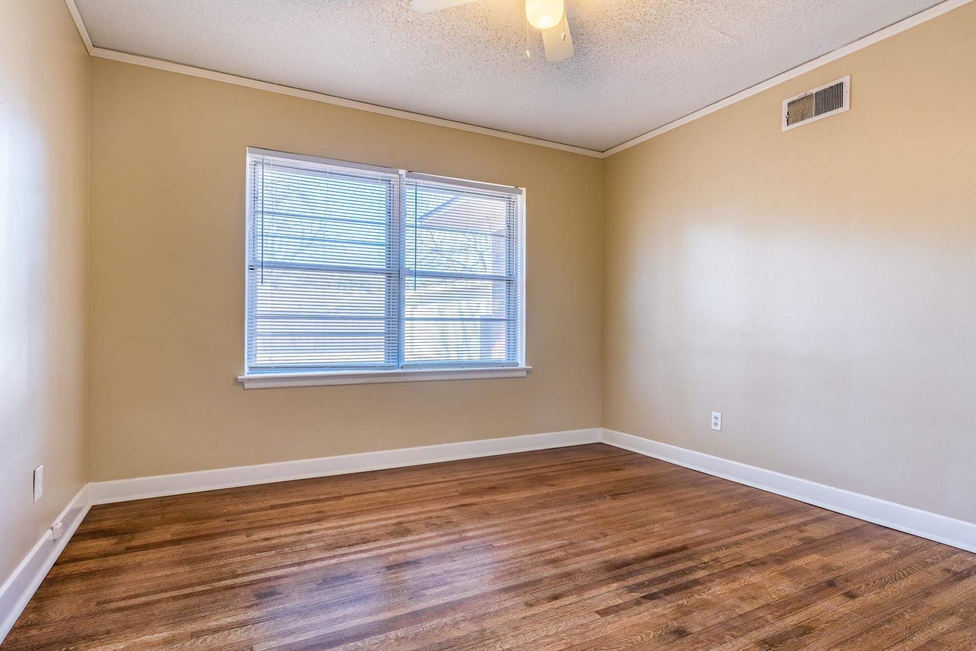 1117 South Perkins Road Memphis, TN 38117 - Photo 20 of 24 a view of a room with wooden floor and windows in it