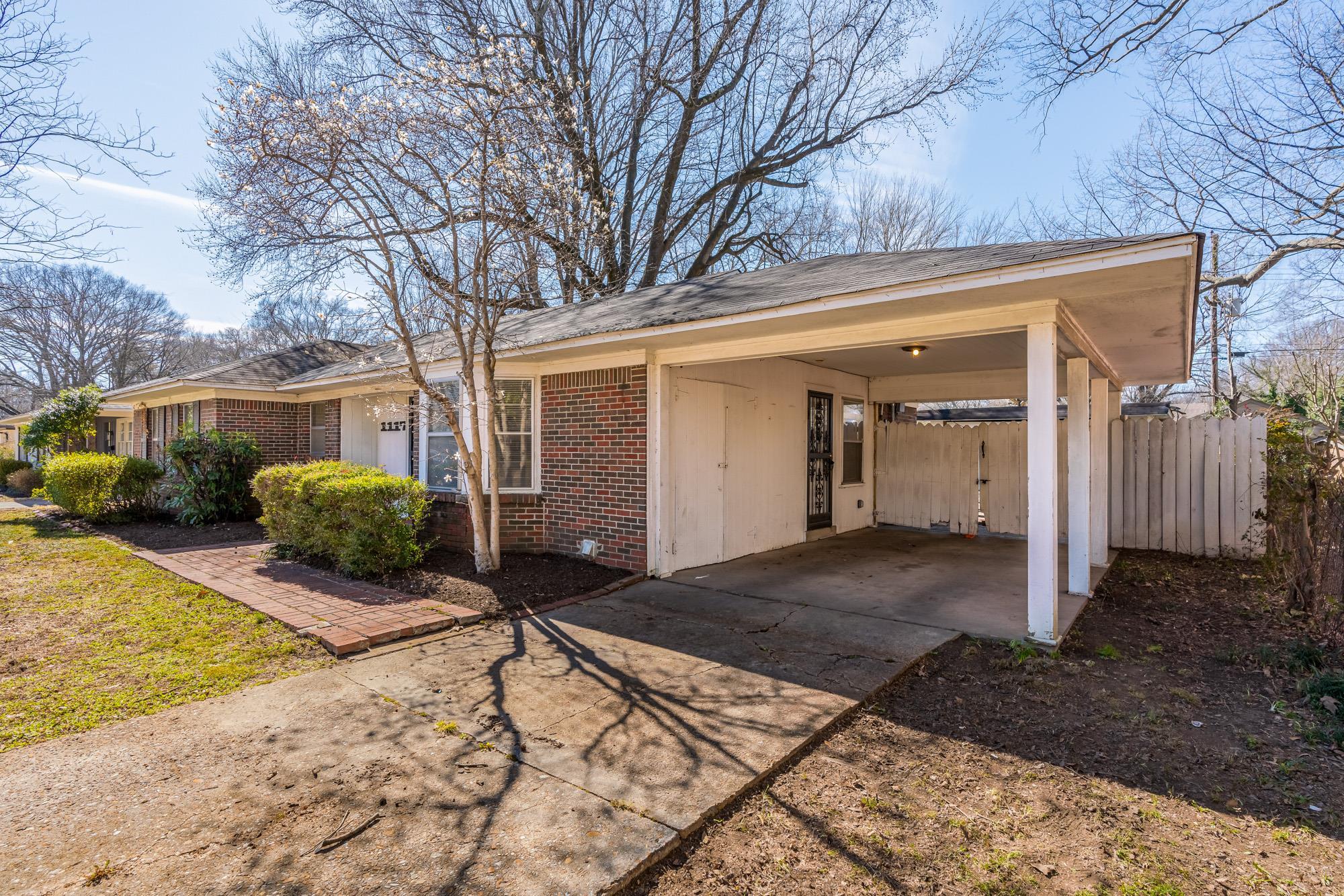 1117 South Perkins Road Memphis, TN 38117 - Photo 2 of 24 a view of a house with snow on the road