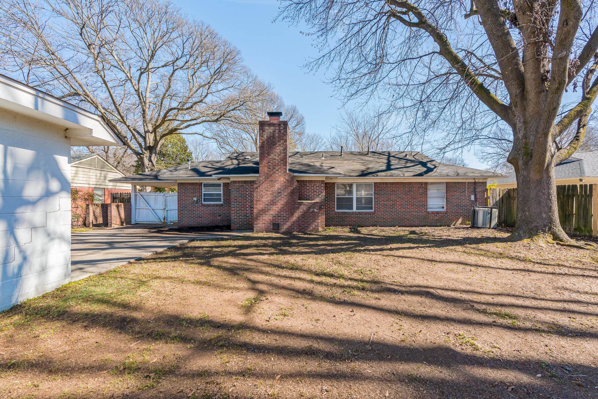 1117 South Perkins Road Memphis, TN 38117 - Photo 21 of 24 a view of a house with a yard covered with snow